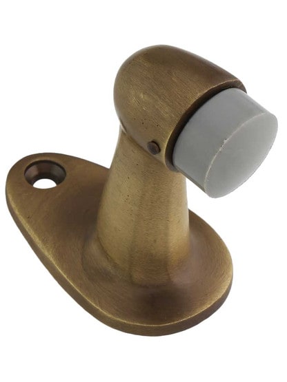 Gooseneck Door Stop with Rubber Bumper in Antique Brass.